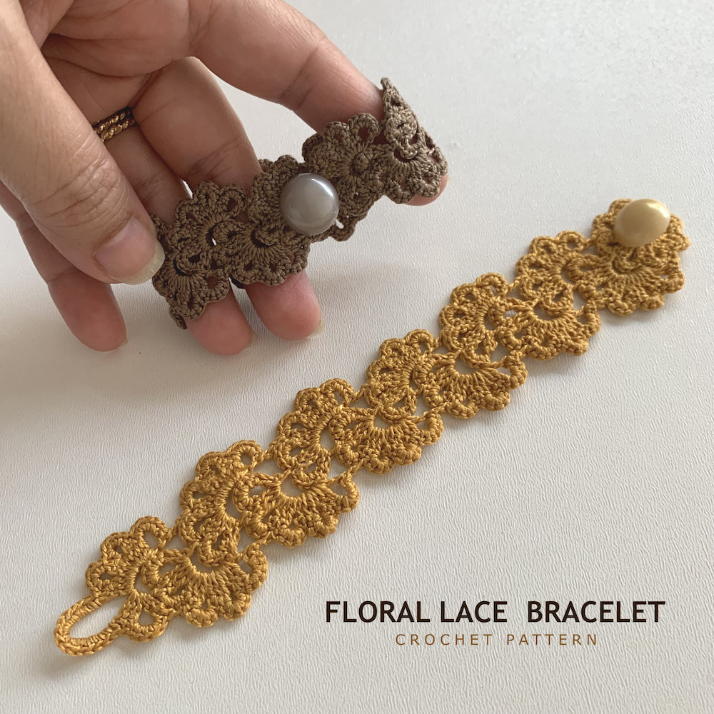 A hand holds a brown crocheted floral lace bracelet with a pearl-like bead, while a larger gold-toned version lies flat on a light surface. Text at the bottom reads 'FLORAL LACE BRACELET CROCHET PATTERN'.