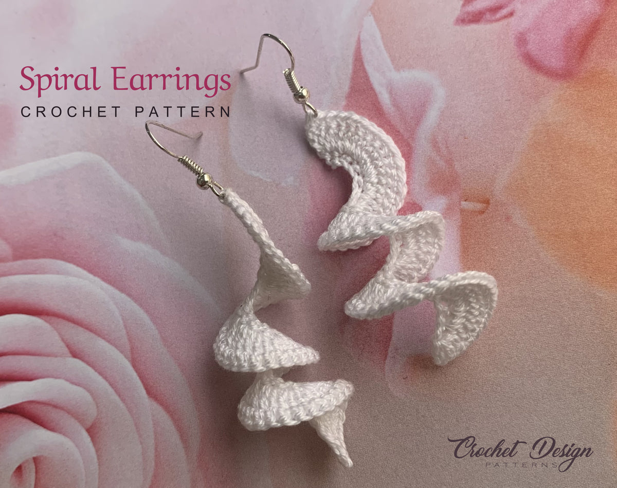 Crochet spiral earrings on floral fabric, PDF pattern by Crochet Design Patterns